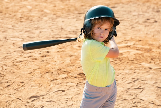 Boy in baseball helmet and baseball bat ready to bat