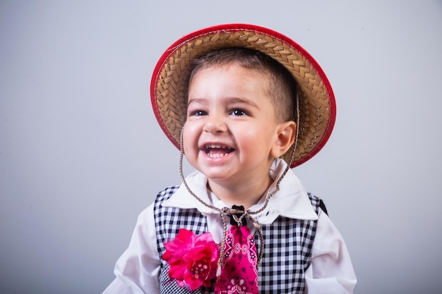 Photo boy brazilian child with clothes from festa junina arraial festa de sao joao horizontal portrait