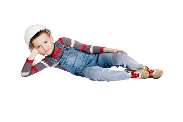 Boy builder in helmet resting