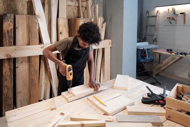 Boy building in workshop