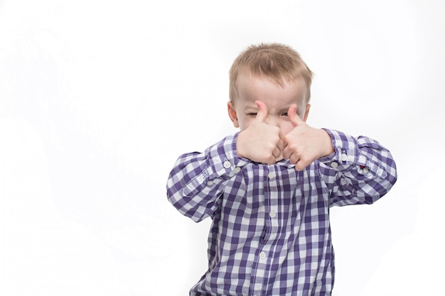 Boy in checkered shirt shows class