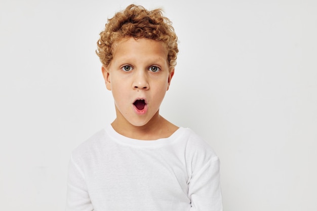 Boy child posing on white background