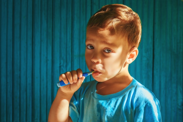 Boy cleaning teeth