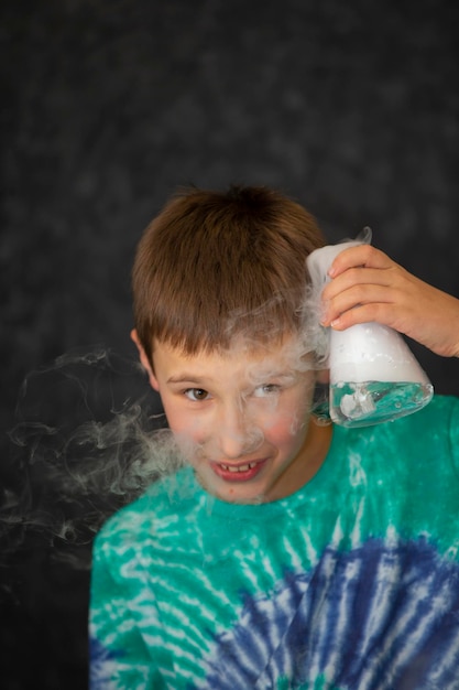 A boy conducts a scientific chemical experiment with liquid nitrogen