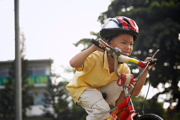 boy cycling at park
