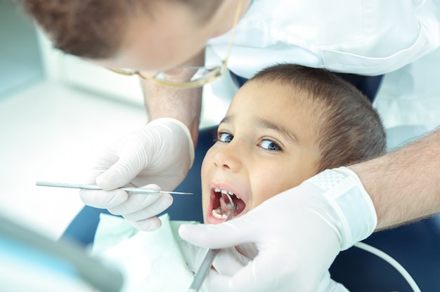 boy at dentist fxing his teeth