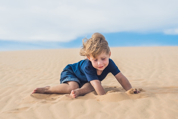 Boy in the desert. Traveling with children concept