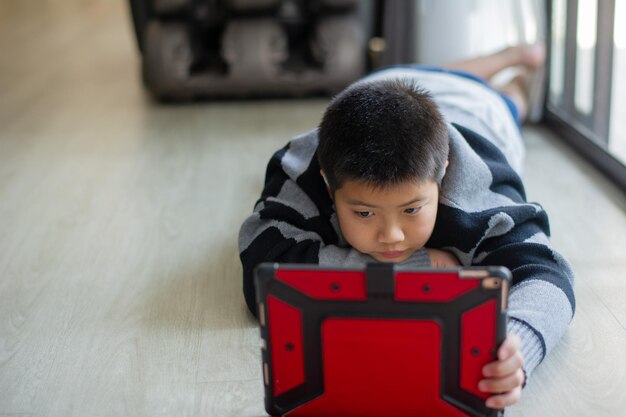 Boy doing homework child writing paper education concept back to school