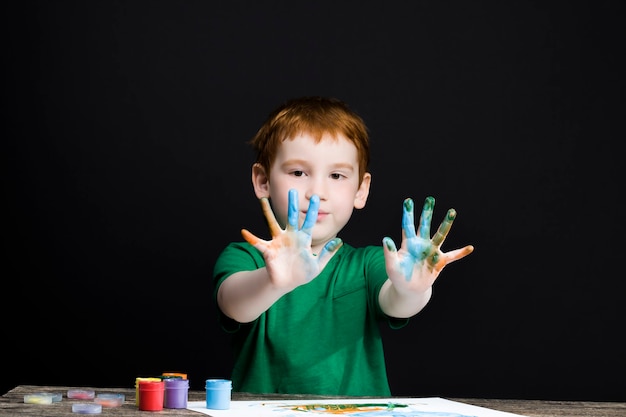 boy draws with his hands