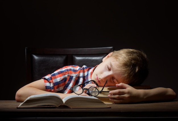 Boy dreaming with a book