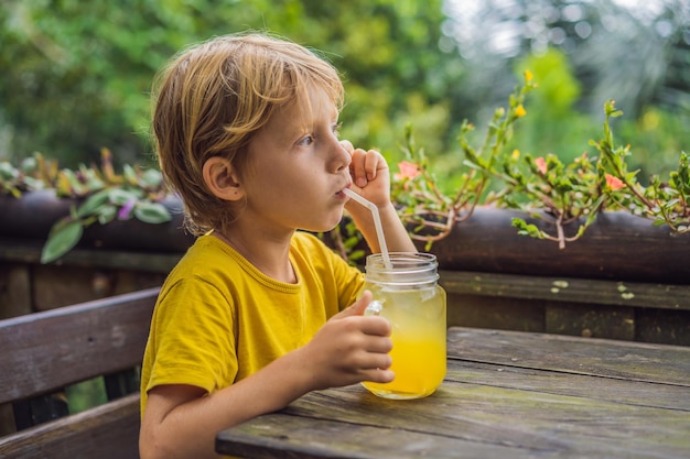 Boy drinking juice in a cafe What to do with children Child friendly place