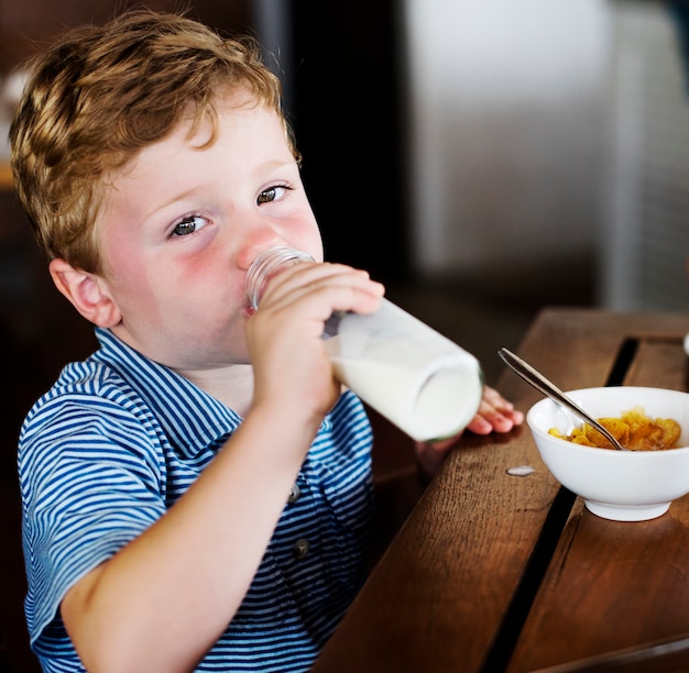 A boy drinking a milk