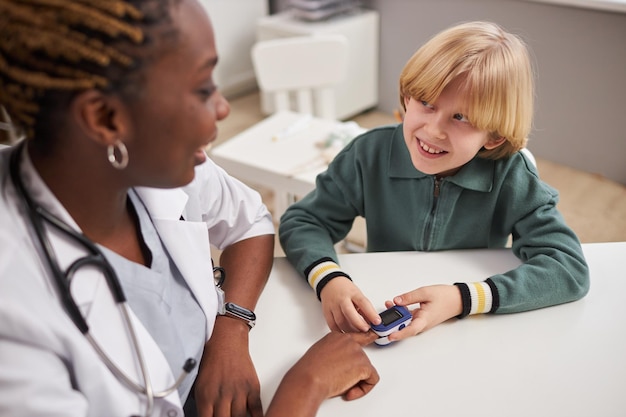 Boy enjoying medical examination in clinic