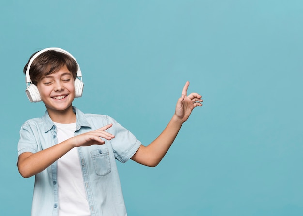 Boy enjoying music and dancing