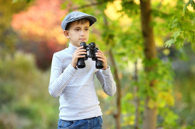 Boy exploring looking through binoculars