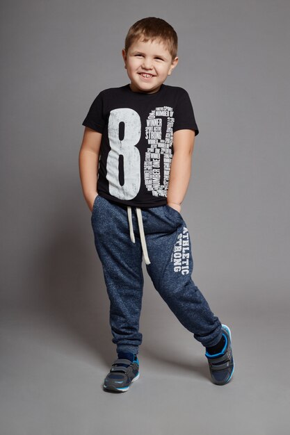 Boy fashionable clothes posing 