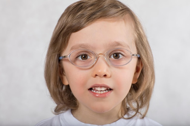 Boy of five years is making some tongue exercises. Closeup