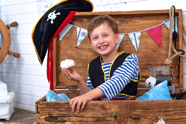 Boy in the form of pirates at the helm.