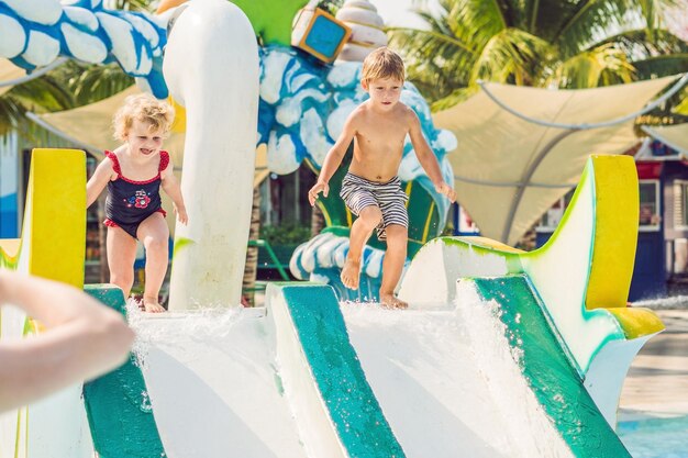 Boy and girl have fun in the water park