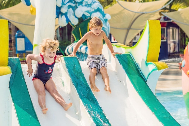 Boy and girl have fun in the water park