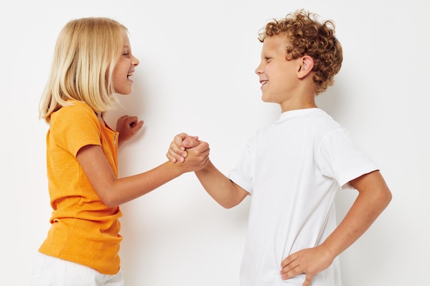 Boy and girl holding hands friendship fun childhood