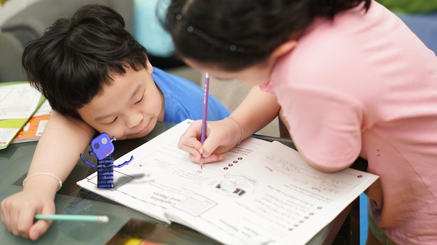 Boy and girl learning coding forhomeschool at home