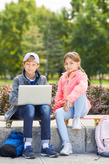 Boy and girl resting outdoors