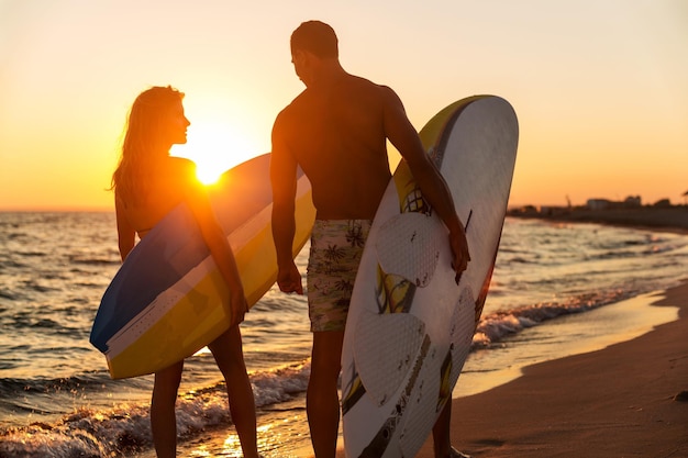 Boy and Girl with Surf Boards