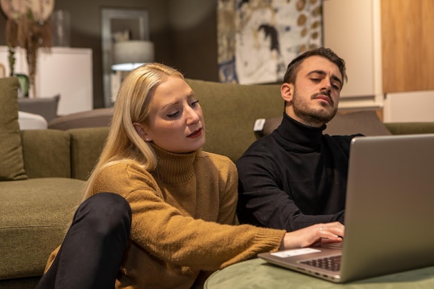 Boy and girl working on laptop