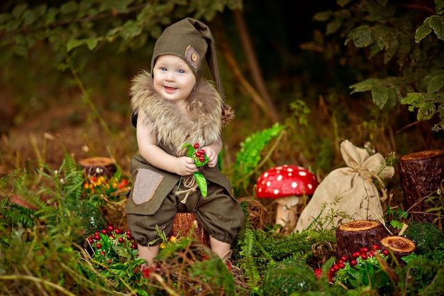 Boy in gnome costume in forest