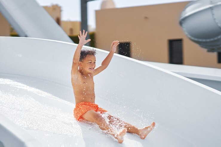 Boy having fun on water slides in Egypt Hurghada