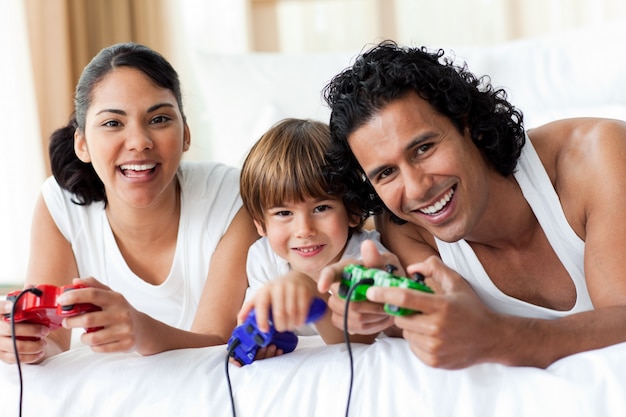 Boy and his parents playing video games