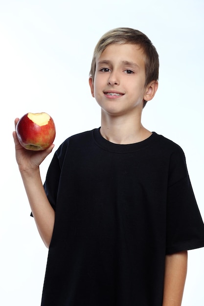 Boy holding an apple