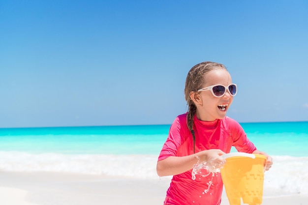 Boy holding ice cream on beach