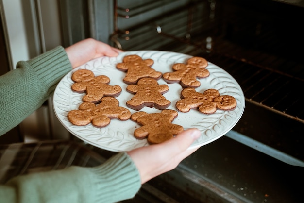 Boy holding plate of cookies