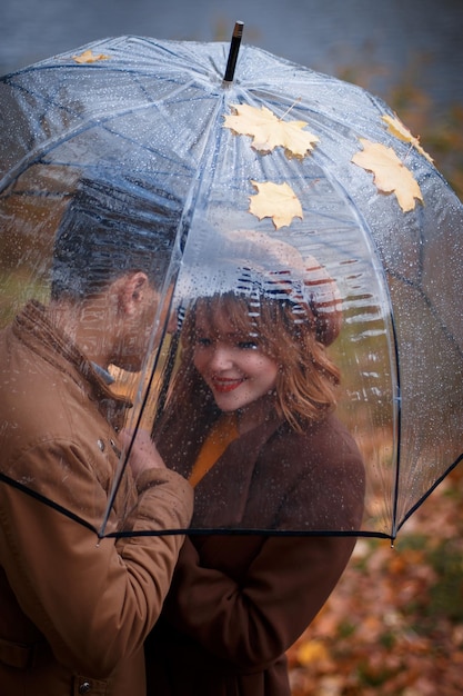 A boy hugs a girl in the USA in autumn in the central park