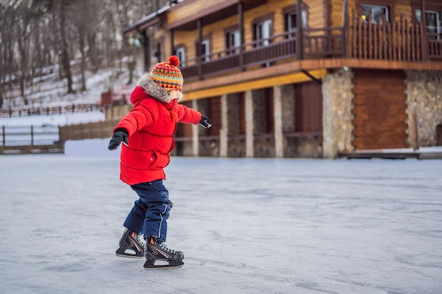 Boy ice skating for the first time