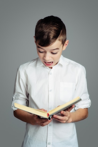 The boy is reading a book