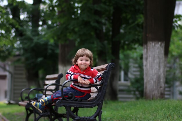 Boy kid bench parl alone