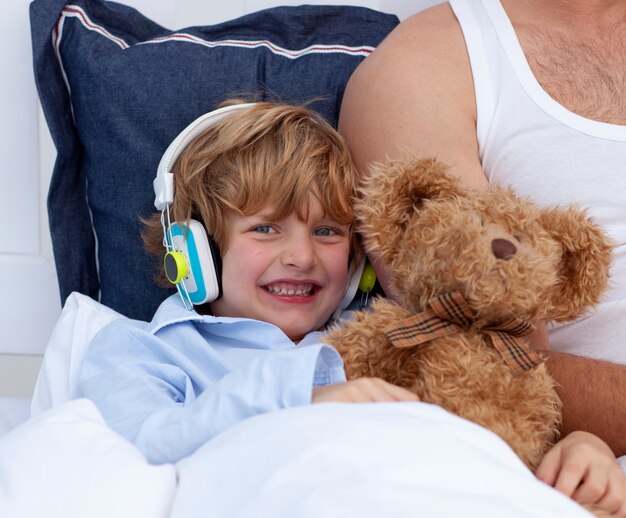 Boy listening to music in bedroom