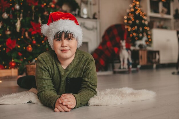 boy lying in christmas decorations