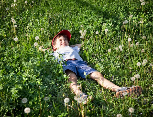 Boy lying on the grass