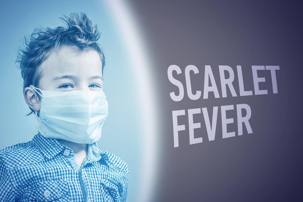 Photo boy in the medical mask next to inscription scarlet fever on brown background