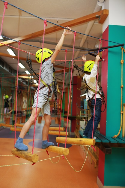 Boy passes an obstacle course, cable car