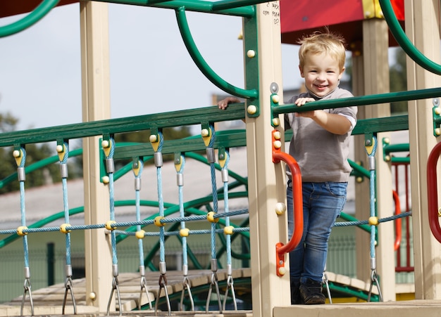 Boy on playground equipment.