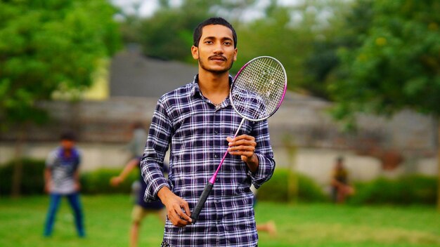 Boy playing badminton High Resolution Stock Photography