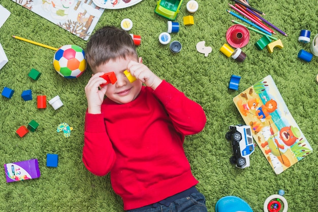 Boy playing toys on floor