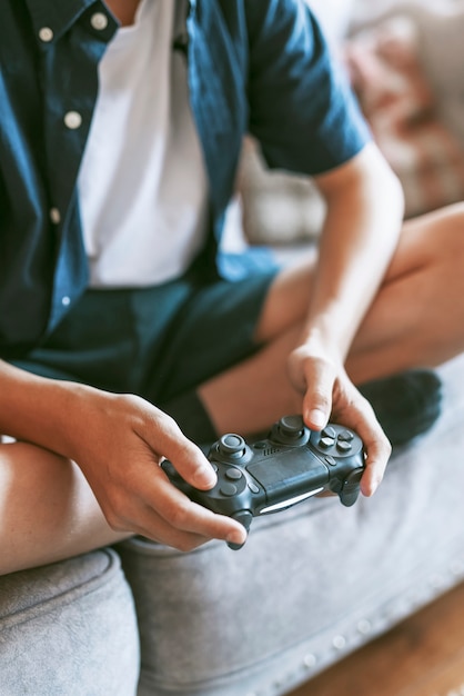 Photo boy playing video game in living room