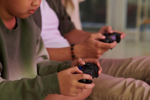 Boy playing videogames with father