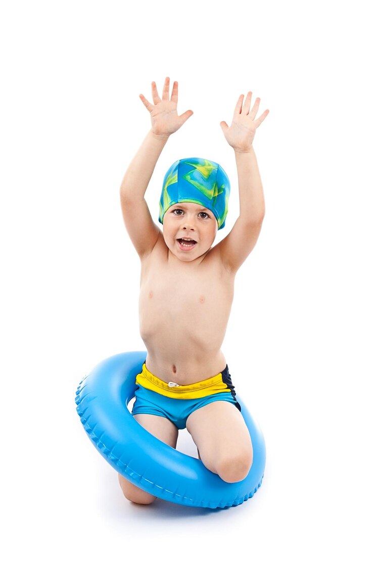 Boy playing with blue life ring